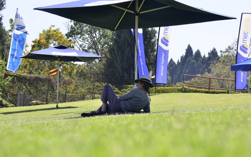 A lone supporter relaxes in the shade.