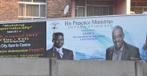 Divine intervention needed? Across the street behind Castle Corner at the intersection of Josiah Tongogara and 4th street, a billboard for a church conference promising supernatural growth
