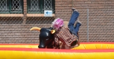 Guy falls off the rodeo Bull