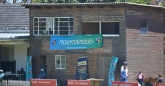 The scorers cabin with a big Mountaineers banner